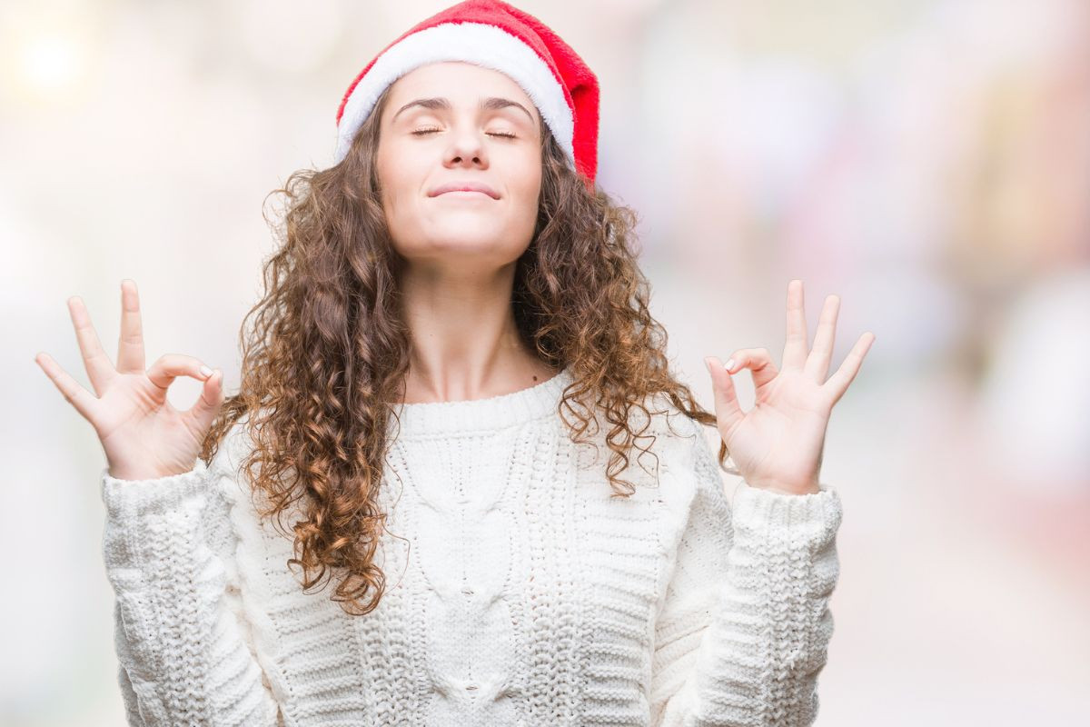 woman in santa hat with white sweater