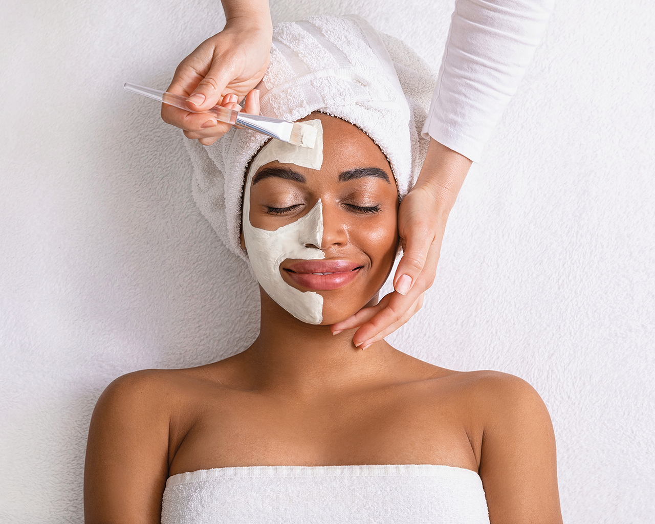 woman receiving facial